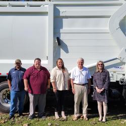 garbage truck and people