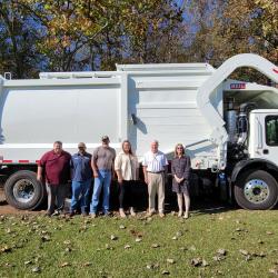 garbage truck and people