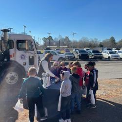 Sanitation Superintendent Carmen Harris interacts with students