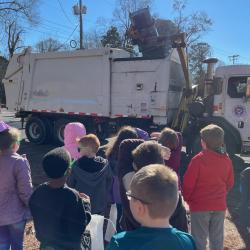 Chris Hall operates the sanitation truck for a demonstration