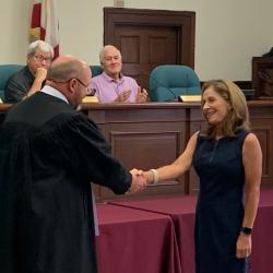 Jenny Brown Short shaking hands with Judge Brakefield