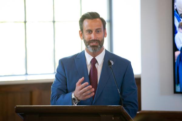 Mayor Josh Gates at podium