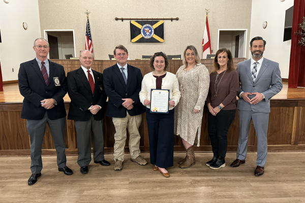 Group picture with city leadership, Asst. DA, other agencies